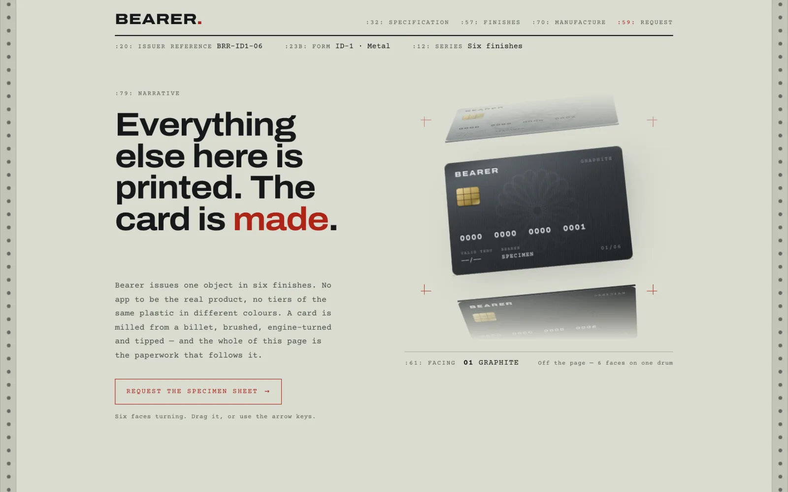 A dark metal payment card angled on a pale technical page reading Everything else here is printed. The card is made.