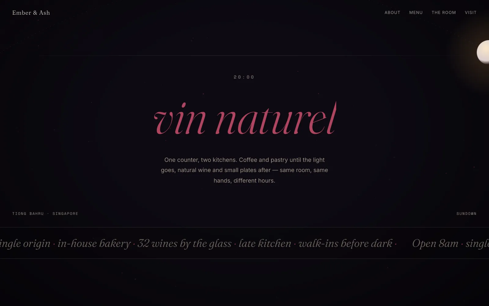 A near-black restaurant page lit by a small warm moon, with vin naturel set in a pink italic serif.
